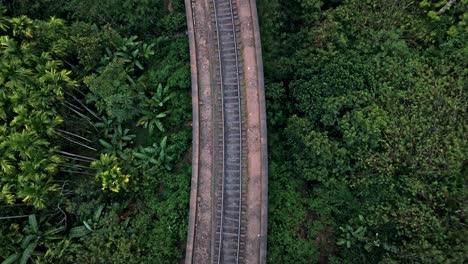 stunning aerial drone footage of the famous nine arches bridge in ella, sri lanka.
