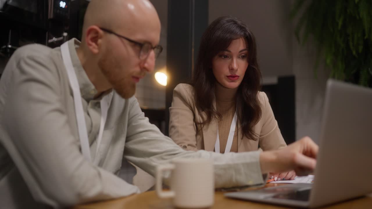 Business meeting with laptop and coworkers