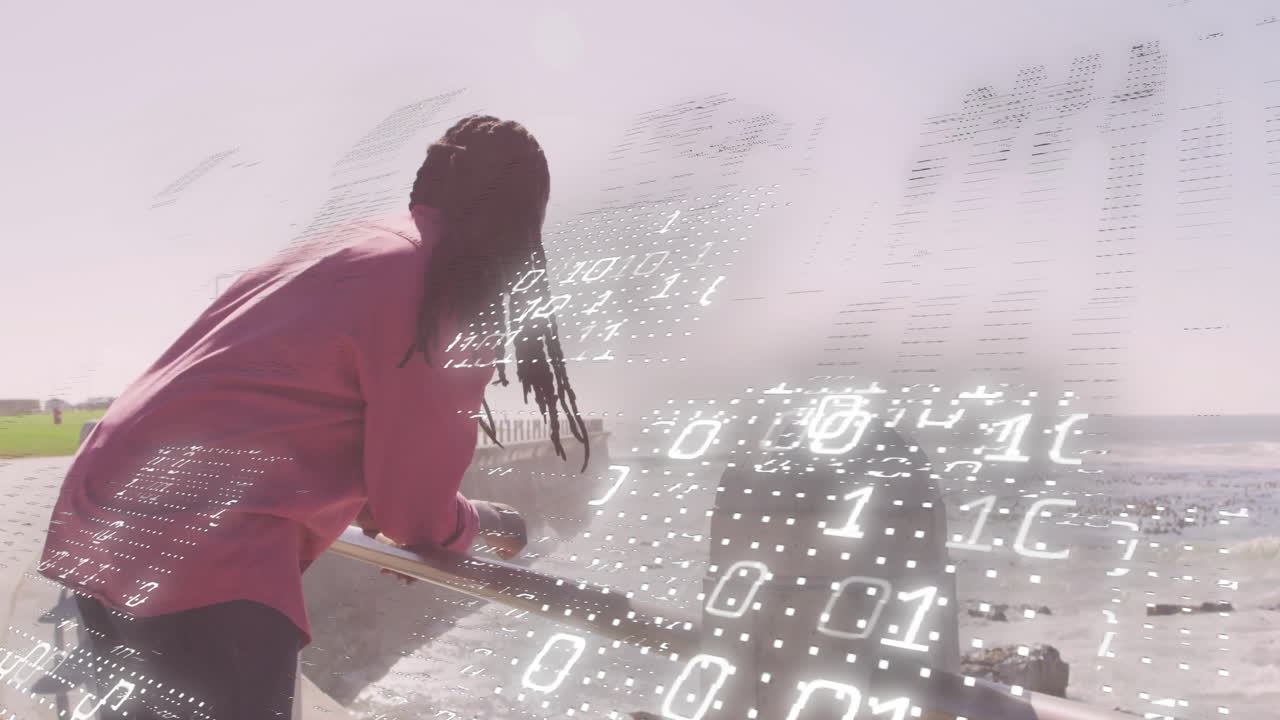 man leaning on railing overlooking shoreline with binary code, digital grid emphasizing technology