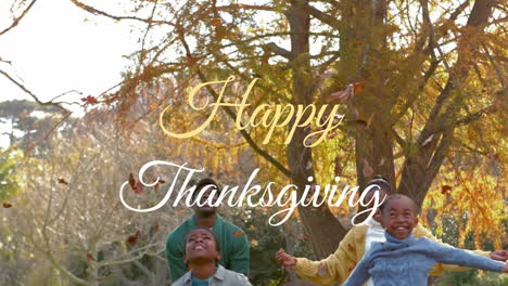 happy thanksgiving text animation over children playing with autumn leaves in park