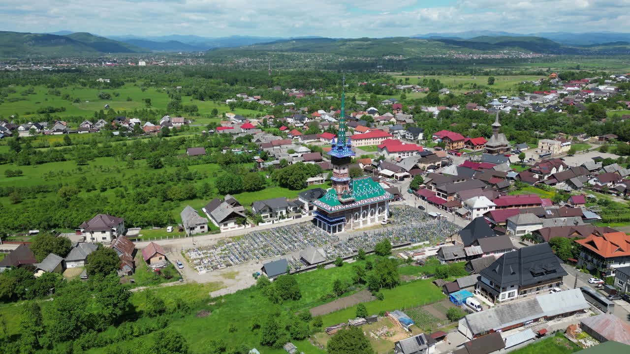 Aerial view of the Merry Cemetery in Sapanta, Romania, a unique cemetery known for its colorful tombstones and humorous epitaphs