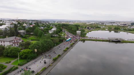 yearly reykjavik marathon event with people gathering near tjörnin lake