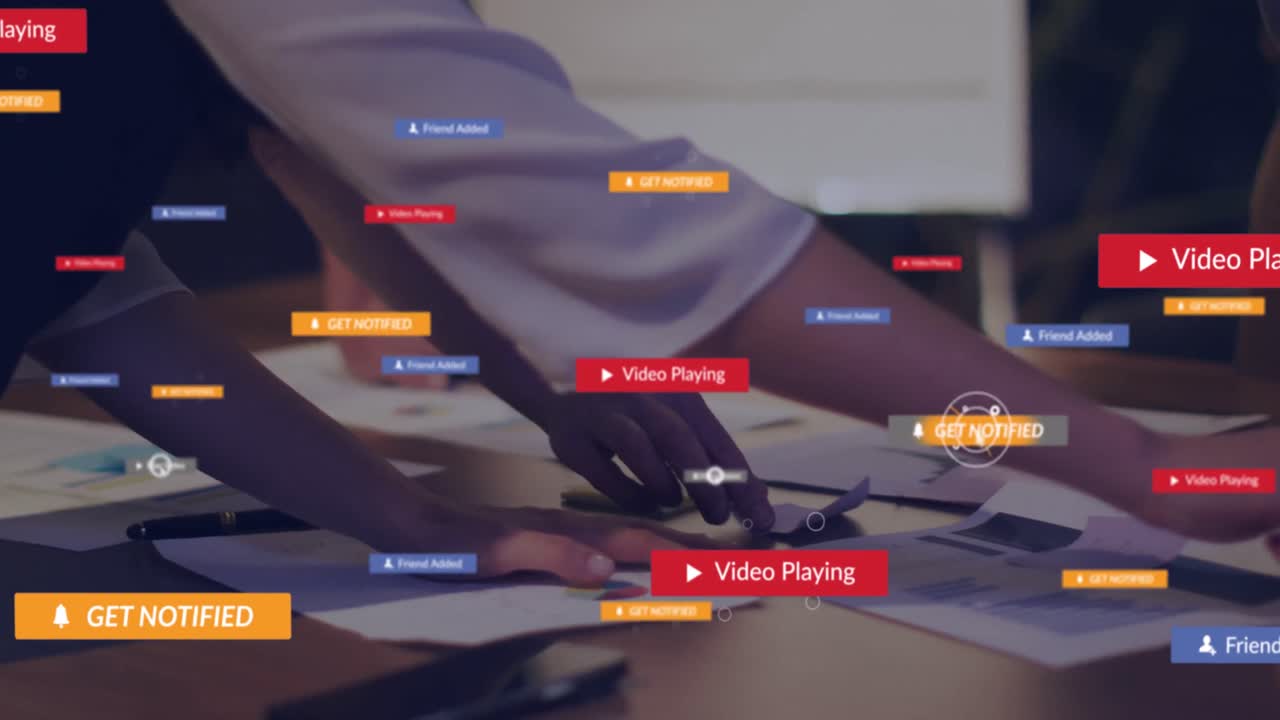 Animation of social media icons with texts over diverse business people working at office