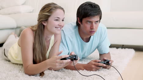 woman winning in a video game against her boyfriend