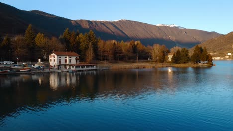 shot over endine lake in italy, picturesque landscape at sunset and mountains on the horizon