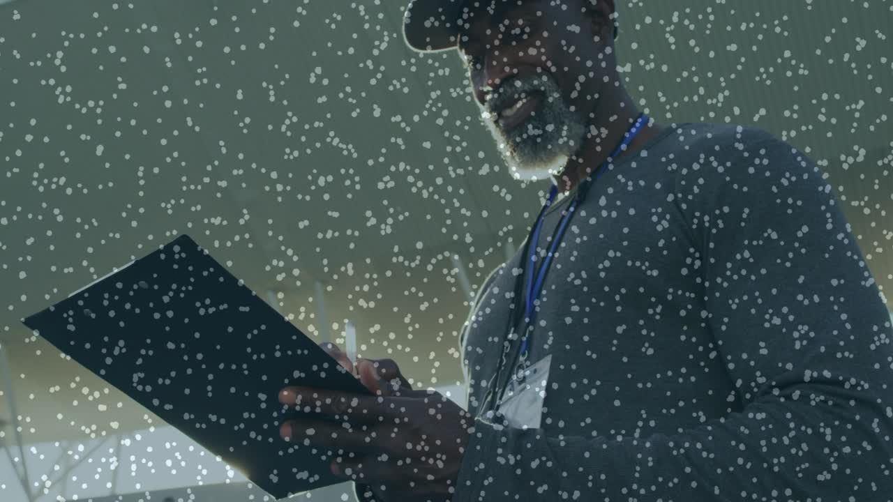 Male tech getting radio call lifting handset checking clipboard logging checks overlay hiding view