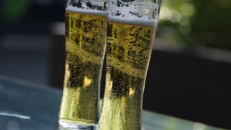 sequential filling of a beer glass outdoors