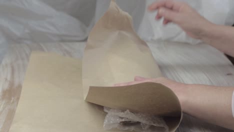 wrapping item in bubble wrap and paper