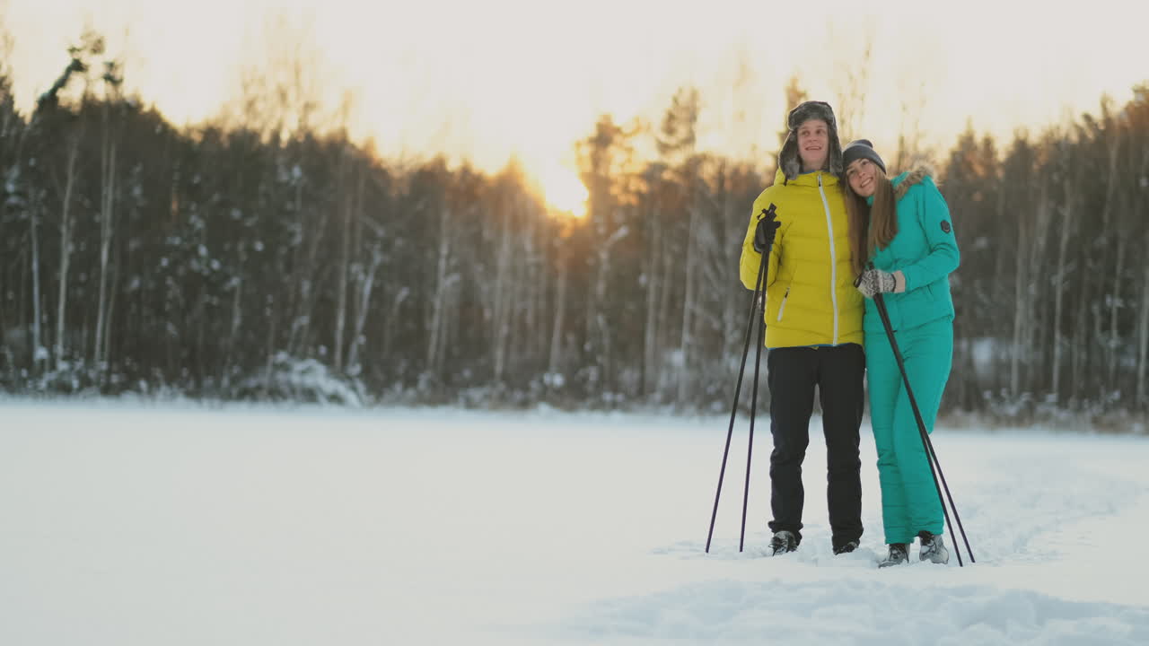 Family skiers spend the weekend together doing skiing in the woods. Healthy lifestyle and active rest.