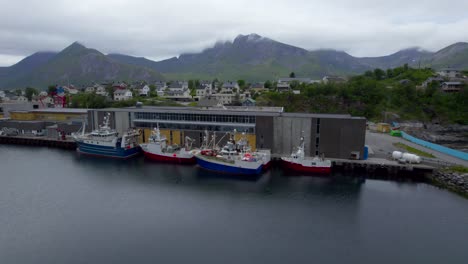 Aerial-sideways-close-up-shot-of-the-fish-Industry-on-Husoy-Island,-Senja,-Northern-Norway