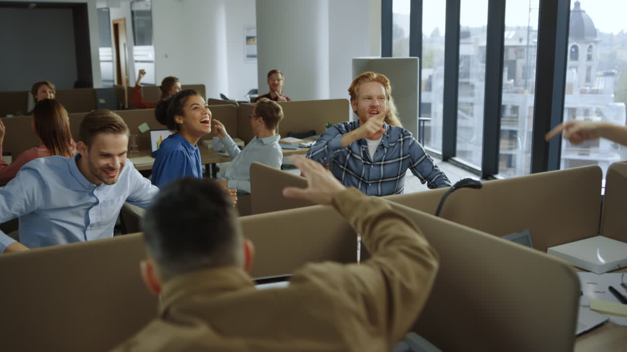 Business people celebrating success during work. Colleagues giving high five