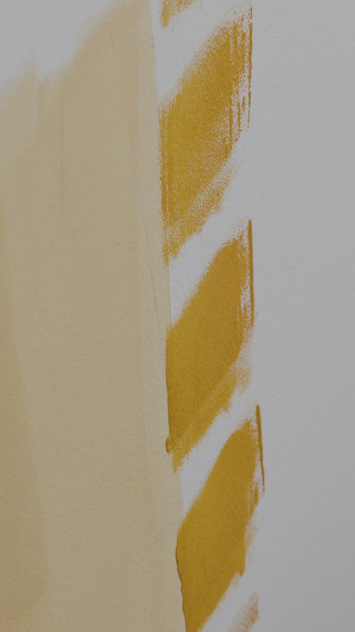 Painting a Wall Yellow with a Paint Roller