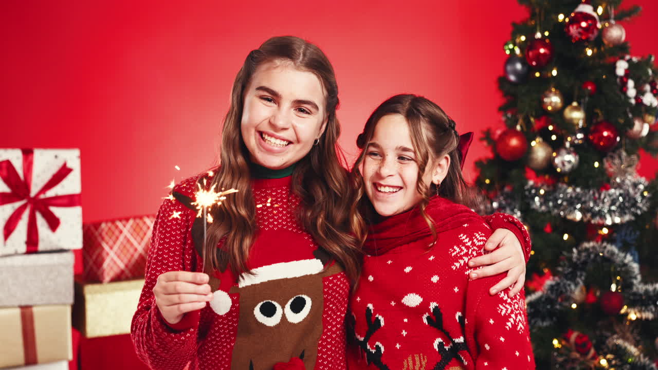 Girls celebrating Christmas with sparklers