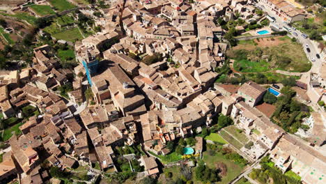 gentle aerial tilt deia mallorca village mountains