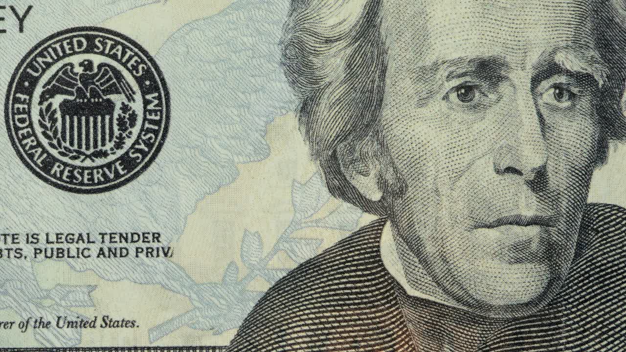 US twenty-dollar bill burning, close up