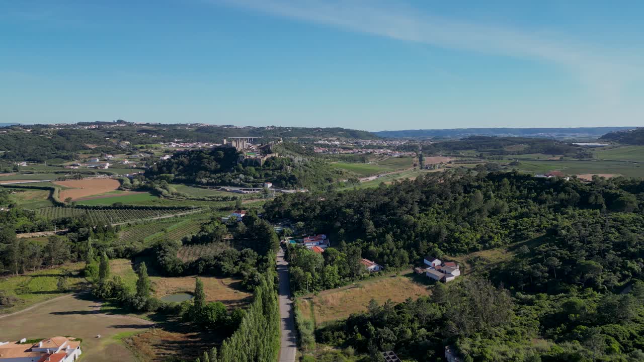 Panoramic view of a green area with houses in slow motion.