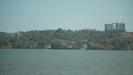 A-coastal-area-of-the-Indian-Ocean-on-the-bay---Houses-and-buildings-on-the-riverside-in-India