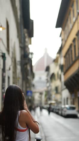 girl taking a photo in florence