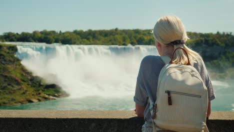 woman admires niagara falls