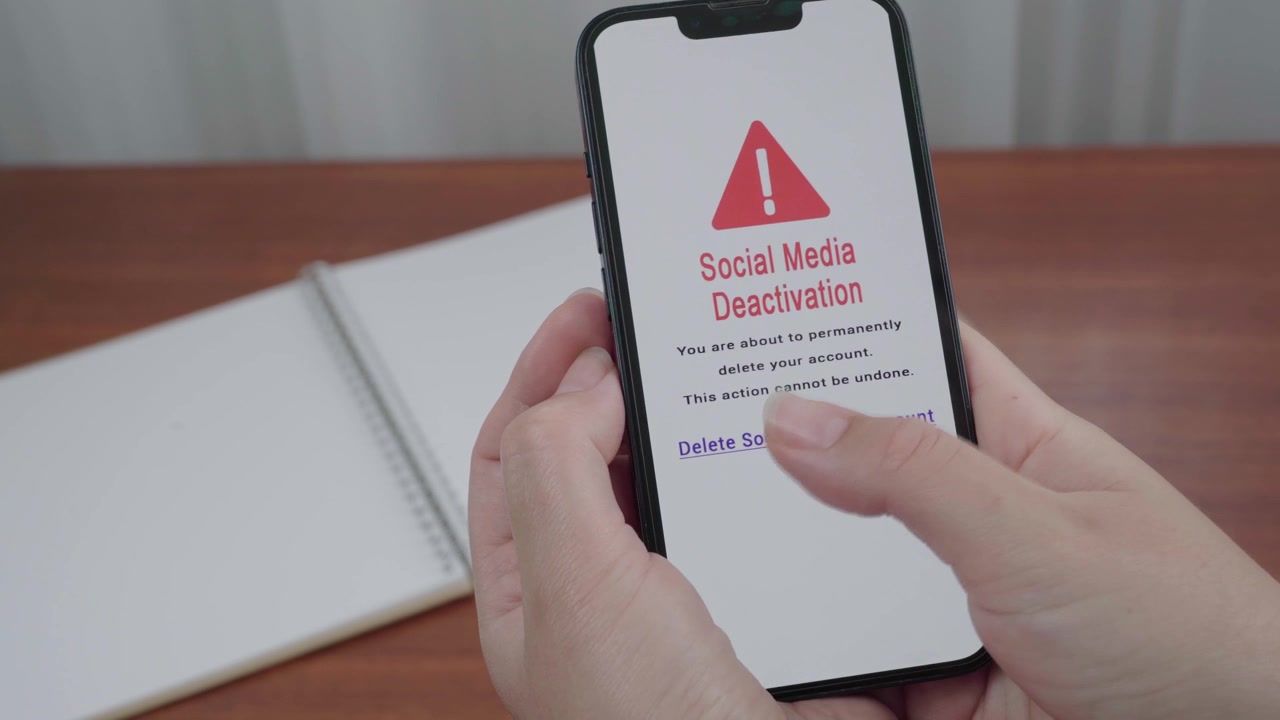 User pauses over an AI powered social media deactivation warning that confirms permanent account deletion on a mobile screen.
