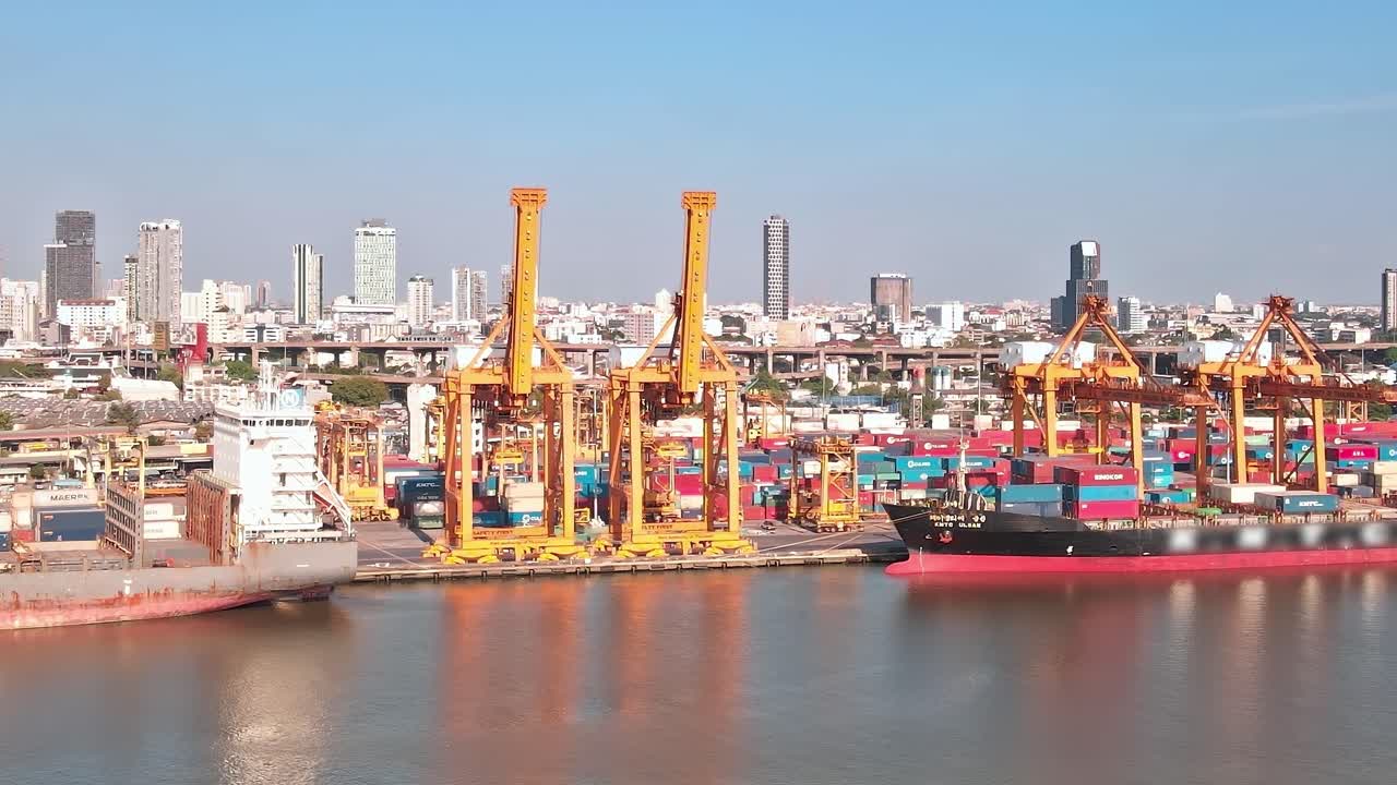 Aerial view of a busy port in Bangkok with cranes and ships