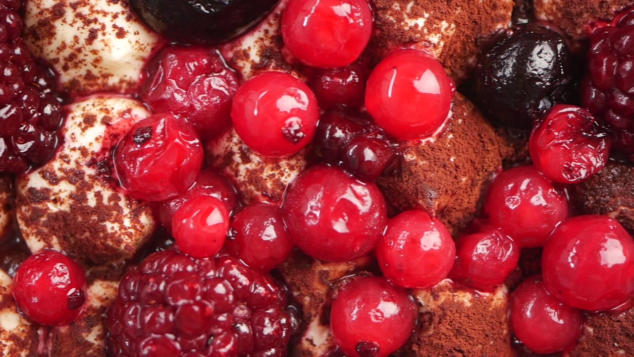 Close-up of a Delicious Berry Dessert Topped with Cocoa Powder