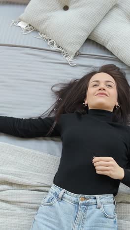 beautiful woman is testing a bed in a furniture store discounts on products black beautiful woman is testing a bed in a furniture store discounts on products black friday