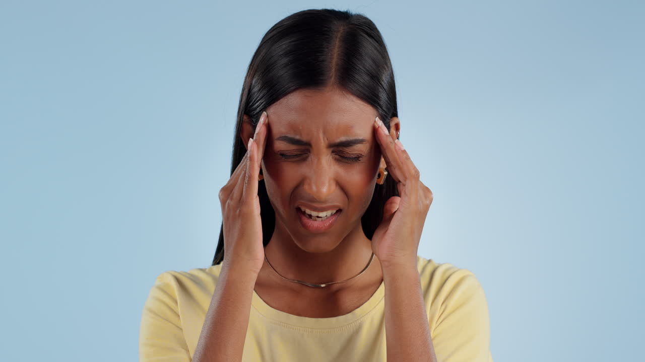 Stress, headache and Indian woman in studio