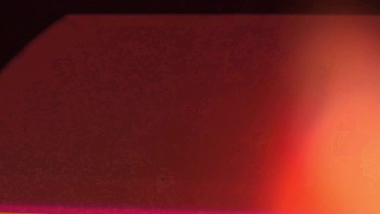 Transition de fuite de lumière abstraite avec des tons chauds orange et rouges