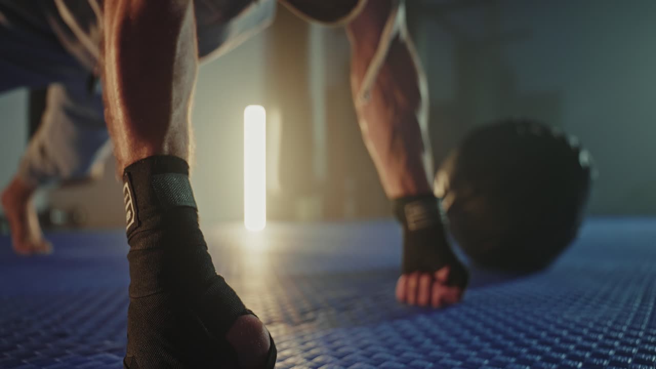 Man Doing Push-ups with Med Ball