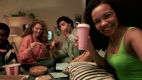 four friends eating at home