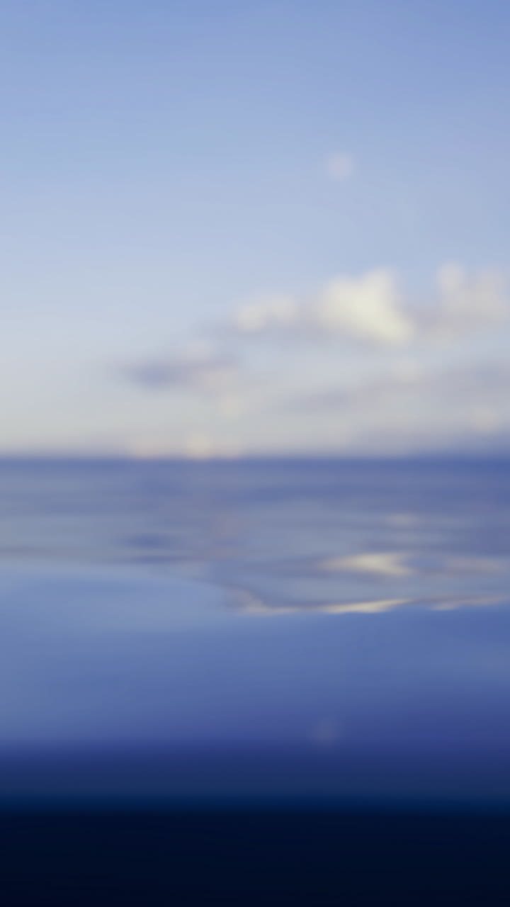 Tranquil sea and sky scene peaceful view of water and clouds at dawn