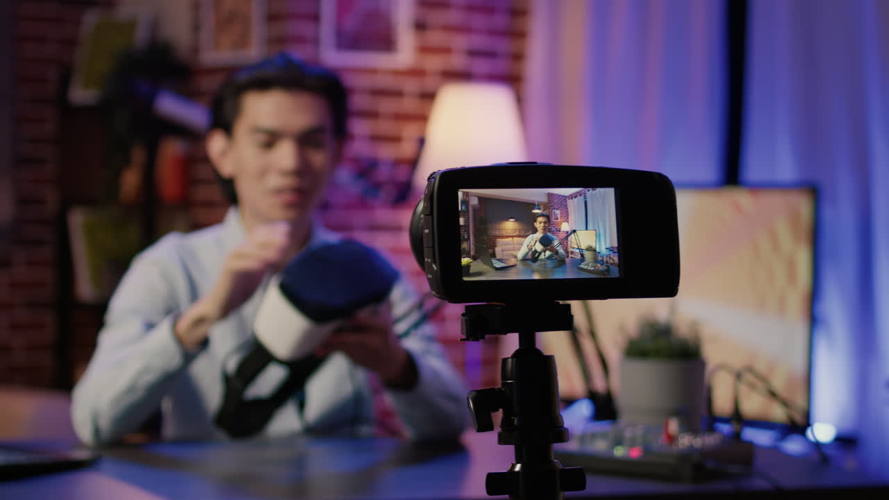 Man vlogging with VR headset and camera