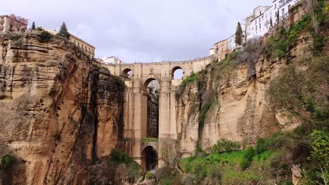 Slide-over-the-gorge-and-bridge-of-Ronda,-Spain