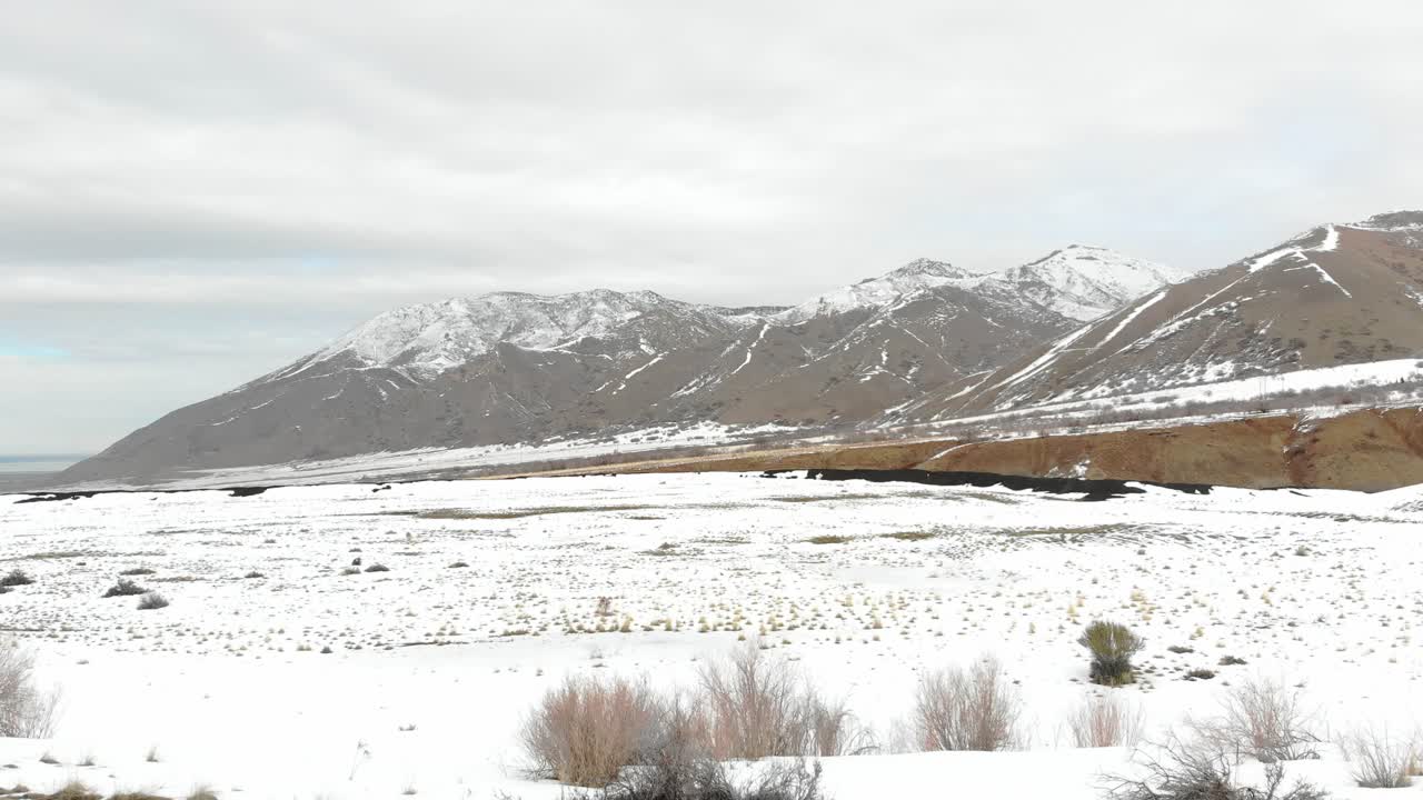 A slow descent onto snow covered valley.