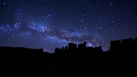 milky way over silhouetted mountains