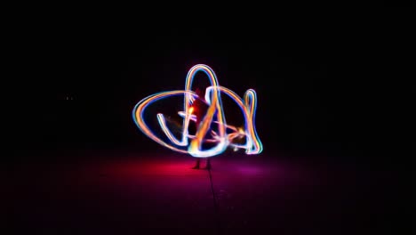 a spectacular display of light trails: the art of motion and color in a darkened space captured through long exposure techniques