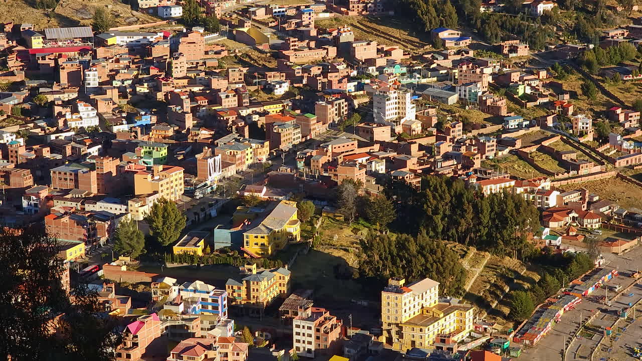 Experience a breathtaking pan shot from Cerro Calvario, revealing the incredible cityscape of Copacabana, Bolivia