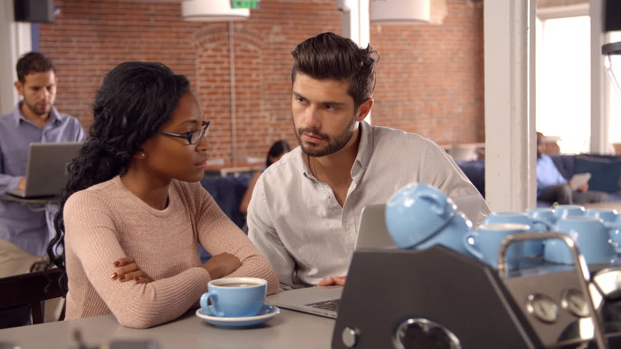 Businesspeople Have Informal Meeting In Office Coffee Bar