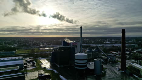 industrial plant emits deadly smoke into atmosphere, aerial view