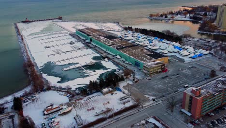 port credit mississauga with boats parked for the winter near water - aerial