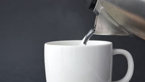 pouring hot water into a mug