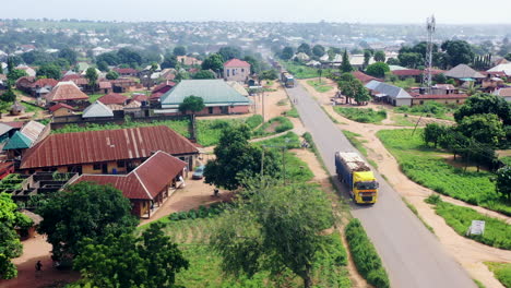 gboko, nigeria highway in benue state in a rural neighborhood - pullback rising aerial