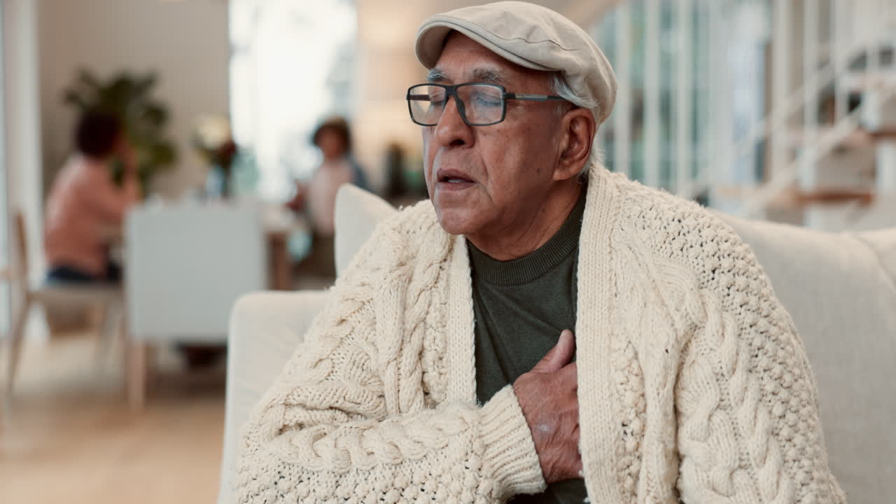 Elderly man coughing