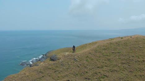 A-photographer-taking-photos-on-top-of-a-hill