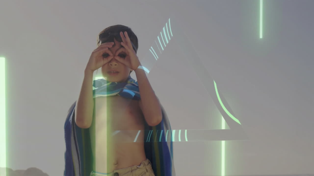 Adjusting goggles, child with digital animation patterns on beach background