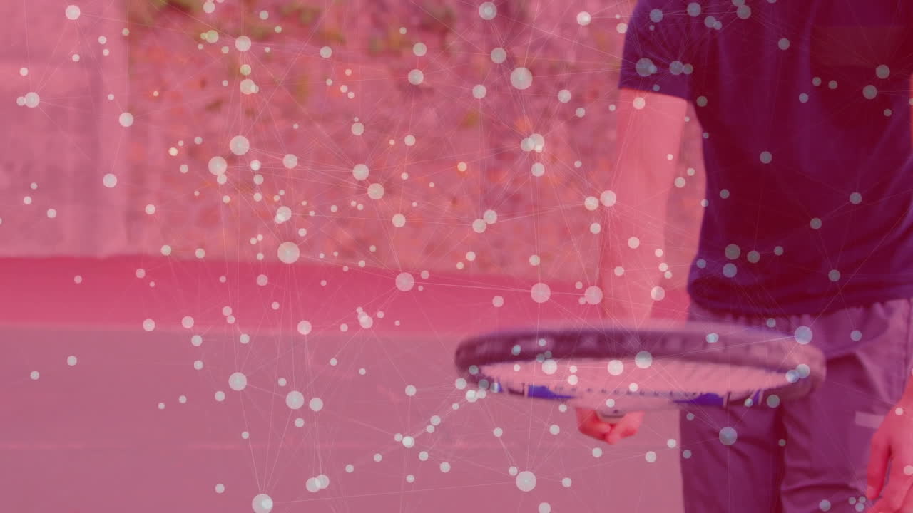 mature man swinging racket at outdoor tennis court, showing floating network overlay in technology