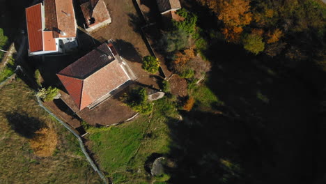 Aerial-View-of-Traditional-Village-in-Portuguese-Countryside-with-Houses-and-a-Road