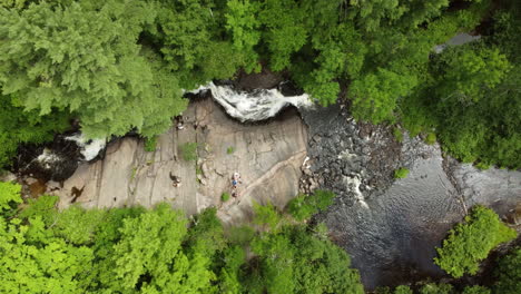 aerial view of a waterfall flowing down through a forest at stubb’s falls at arrowhead park, ontario, canada