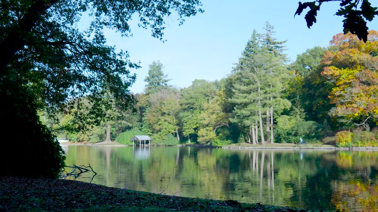 Scenic Lake with Trees and Boathouse
